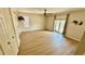 Bright bedroom with neutral walls, wood-look floors and sliding doors to the outdoor area at 1670 Monterey Dr, Clearwater, FL 33756