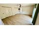 Bedroom featuring neutral walls, wood-look floors, a ceiling fan, and ample closet space at 1670 Monterey Dr, Clearwater, FL 33756