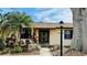 Charming home featuring a well-manicured front yard, complemented by a beautiful double-door entrance at 1670 Monterey Dr, Clearwater, FL 33756