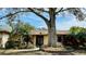 Charming single-story home featuring a mature tree in the front yard for ample shade at 1670 Monterey Dr, Clearwater, FL 33756