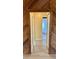 Hallway featuring wood-look floors, and access to multiple rooms for seamless flow at 1670 Monterey Dr, Clearwater, FL 33756
