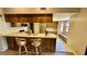 Kitchen with breakfast bar, modern stainless appliances, and eat-in nook area at 1670 Monterey Dr, Clearwater, FL 33756