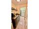 Functional laundry room featuring updated appliances and ample storage options at 1670 Monterey Dr, Clearwater, FL 33756