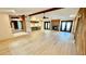 Open concept living room with kitchen and fireplace, perfect for entertaining and gatherings at 1670 Monterey Dr, Clearwater, FL 33756