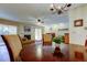 Dining area with hardwood floors, chandelier, and fireplace at 2559 Stony Brook Ln, Clearwater, FL 33761