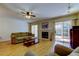 Inviting living room with fireplace and sliding doors to the outdoors at 2559 Stony Brook Ln, Clearwater, FL 33761