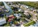 Aerial view of waterfront property with a pool, private dock, and lush landscaping at 4643 Bay Crest Dr, Tampa, FL 33615