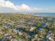 Panoramic aerial view of waterfront community with lush landscaping and stunning water views at 4643 Bay Crest Dr, Tampa, FL 33615