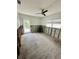 Bedroom featuring a ceiling fan, natural light, and outdoor access at 50 Acacia St, Clearwater Beach, FL 33767