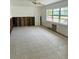 Bright living room featuring a ceiling fan, natural light and a view to the outdoors at 50 Acacia St, Clearwater Beach, FL 33767