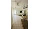 Utility room or mud room with shelves, door to outside, and sink at 50 Acacia St, Clearwater Beach, FL 33767