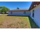 Backyard of a single-Gathering home with a well kept lawn at 5729 13Th St, Zephyrhills, FL 33542