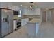 Updated kitchen with stainless steel appliances, granite countertops, and a central island at 5729 13Th St, Zephyrhills, FL 33542