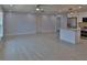 Inviting living room featuring tile floors, recessed lighting, neutral paint, and an adjacent kitchen at 5729 13Th St, Zephyrhills, FL 33542