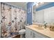 Charming bathroom featuring sea-themed decor, vanity, and ample lighting at 7300 Sunshine Skyway S Ln # 202, St Petersburg, FL 33711