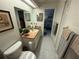 Bathroom features a vanity with sink, toilet and attached shower at 9337 Zamora Dr, New Port Richey, FL 34655