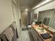 Bathroom features vanity with plants, shower and towel racks at 9337 Zamora Dr, New Port Richey, FL 34655