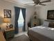 Charming bedroom with matching end tables and lamps, complemented by a ceiling fan and a plush bed at 9337 Zamora Dr, New Port Richey, FL 34655