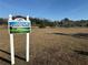 Riverside Villas, welcome to Prado Park community sign with image of deer grazing in the lush green land at 9337 Zamora Dr, New Port Richey, FL 34655