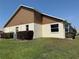 Two-tone exterior with manicured landscaping, healthy lawn and a lush shrub line at 9337 Zamora Dr, New Port Richey, FL 34655