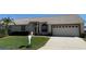 Charming single-story home with well-manicured lawn, mature landscaping, and a two-car garage at 9337 Zamora Dr, New Port Richey, FL 34655