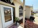 Inviting front entrance with decorative glass door, arched window and well-maintained landscape at 9337 Zamora Dr, New Port Richey, FL 34655