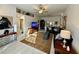 Open-concept living room featuring tile floors, ceiling fan and neutral paint at 9337 Zamora Dr, New Port Richey, FL 34655