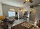 Cozy front room with arched window bringing natural light into the space, featuring tile floors and decor at 9337 Zamora Dr, New Port Richey, FL 34655