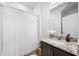 Bathroom with a granite vanity and a shower with a white curtain at 11616 Little River Way, Parrish, FL 34219