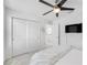 Bright bedroom with a ceiling fan, closet, and TV offering a relaxing space at 11616 Little River Way, Parrish, FL 34219