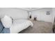Large primary bedroom with a tray ceiling and carpet floors at 11616 Little River Way, Parrish, FL 34219