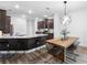 Stylish kitchen and dining area with granite countertops, pendant lighting, and stainless appliances at 11616 Little River Way, Parrish, FL 34219