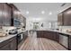 Beautiful kitchen showcasing stainless steel appliances and an open view into the living area at 11616 Little River Way, Parrish, FL 34219