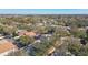Community aerial view showing neighborhood with beautiful homes and tree coverage at 1764 Oak Spring Dr, Tarpon Springs, FL 34689