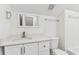 Bathroom featuring sink with granite countertop and white cabinets at 1764 Oak Spring Dr, Tarpon Springs, FL 34689