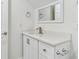 Bathroom features modern fixtures, including a single sink and ample cabinet space at 1764 Oak Spring Dr, Tarpon Springs, FL 34689