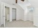 An attic bedroom with closet and white walls and carpeted floors at 1764 Oak Spring Dr, Tarpon Springs, FL 34689