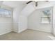 Bedroom featuring carpeted floors and two windows for natural light at 1764 Oak Spring Dr, Tarpon Springs, FL 34689