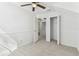 An attic bedroom with closet and white walls and carpeted floors at 1764 Oak Spring Dr, Tarpon Springs, FL 34689
