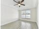 Bright and airy bedroom with window and ceiling fan offering peaceful pool views at 1764 Oak Spring Dr, Tarpon Springs, FL 34689