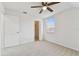 Bedroom with closet, window, and carpeted floors at 1764 Oak Spring Dr, Tarpon Springs, FL 34689