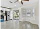 Dining area with bay window, adjacent to stainless steel kitchen appliances and sliding doors at 1764 Oak Spring Dr, Tarpon Springs, FL 34689