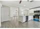 Bright kitchen with white cabinets, stainless steel appliances, and gray tile flooring at 1764 Oak Spring Dr, Tarpon Springs, FL 34689