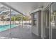 Enjoy the screened in patio and private pool accessible through sliding glass doors at 1764 Oak Spring Dr, Tarpon Springs, FL 34689
