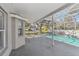 Exterior view of the screened in patio and pool at 1764 Oak Spring Dr, Tarpon Springs, FL 34689
