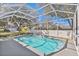 Enjoy the pool and backyard views from this screened-in enclosure at 1764 Oak Spring Dr, Tarpon Springs, FL 34689