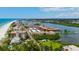 Breathtaking aerial view of beachfront condos along the coast with canal and city views at 19701 Gulf Blvd # 328, Indian Shores, FL 33785