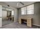 Cozy bedroom featuring built-in shelving, a desk, and a mirrored closet at 19701 Gulf Blvd # 328, Indian Shores, FL 33785