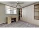 Bedroom with a desk, large window, ceiling fan and built in storage at 19701 Gulf Blvd # 328, Indian Shores, FL 33785