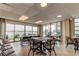 Well-lit common room featuring floor-to-ceiling windows with harbor views at 19701 Gulf Blvd # 328, Indian Shores, FL 33785